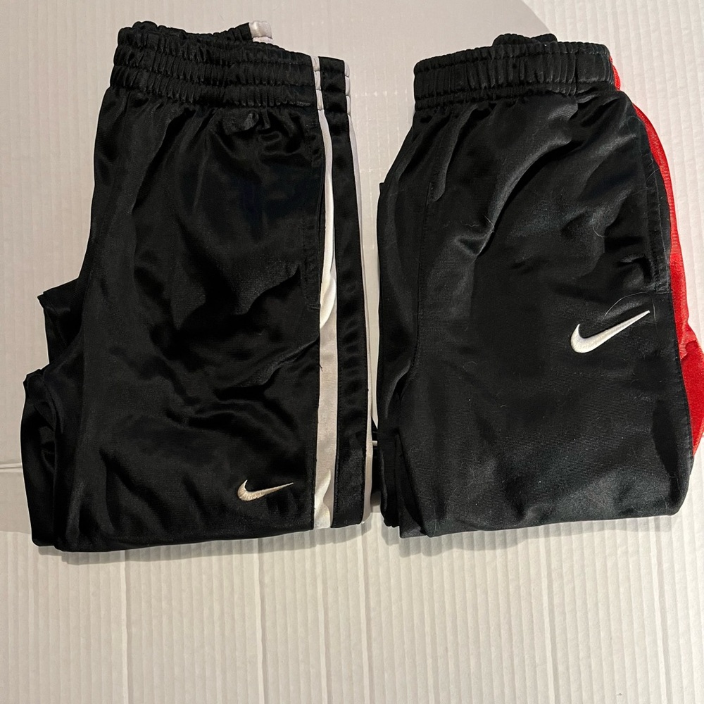 Two pair of boys Nike athletic pants. Black size 7